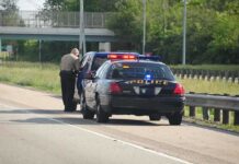 525 Lbs of Cocaine Found in Routine Traffic Stop Police officer conducting a traffic stop on a highway