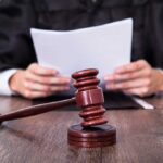 Abortion Horror — Ohio Doctor’s Heinous Act A judge holding documents with a gavel in the foreground