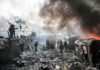Russia’s Chilling Warning: Evacuate Kyiv NOW A chaotic protest scene with smoke, fire, and people holding flags