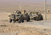 Al-Qaeda’s SHOCK Takeover–No One Saw This Coming! Two military humvees with soldiers in a desert landscape