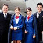Airline’s Stunning $1M Payout EXPOSED Group of airline crew members posing together at an airport