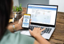 Digital ID Fight Goes Global Person using online banking on laptop and smartphone.