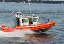 Apache Down Near Iran, Trump Vows Response Coast Guard boat speeding on the water.