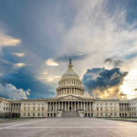 Congress Orders Trump: Stop The War U.S. Capitol building with dramatic cloudy sky.