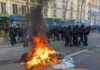Paris Erupts After PSG Win — Injuries Mount, Arrests Near 800 as City Spirals Into Unrest Protesters and police clash; fire in the street.