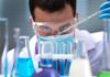 Warning in Pipes, No Patients Found Scientist conducting an experiment with blue liquids in a laboratory