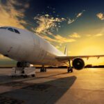 Cold War Bombshell: Did America Try to Buy Soviet Nuclear Bombers? An airplane parked on the runway during sunset with a colorful sky