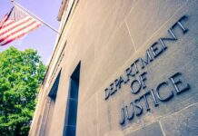 Migrant Child Sponsorship Fraud Exposes System Failures Exterior view of the Department of Justice building with an American flag