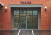Immigration Row Flares After Belfast Attack Entrance of a modern police station with brick facade