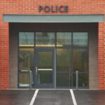 Immigration Row Flares After Belfast Attack Entrance of a modern police station with brick facade