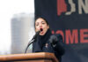 Archived Blog Posts Add New Context to Candace Woman speaking passionately at podium during outdoor event.
