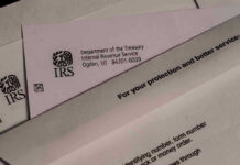 IRS letters and envelopes on a table.