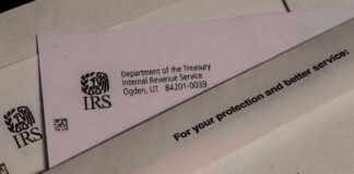 IRS letters and envelopes on a table.