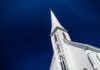 Viral Church Videos Raise Questions About Religious Influence White church steeple against deep blue sky