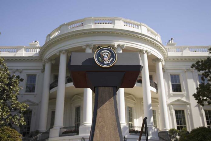 Presidential,Seal,On,Podium,In,Front,Of,The,South,Portico Press podium with presidential seal in front of the White House