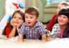 California Proposal to Affirm Black English Revives Ebonics Debate A group of children enjoying playtime indoors, displaying joyful expressions