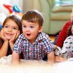 California Proposal to Affirm Black English Revives Ebonics Debate A group of children enjoying playtime indoors, displaying joyful expressions