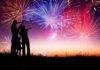 Culture War: Half a Million Gather Under One Flag Silhouetted figures watching a colorful fireworks display against a twilight sky