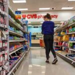 FDA Greenlights ZYN Nicotine Pouches A person shopping in a CVS pharmacy aisle filled with various products