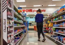 FDA Greenlights ZYN Nicotine Pouches A person shopping in a CVS pharmacy aisle filled with various products