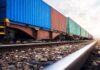 Freight train with colorful shipping containers on railway tracks
