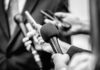DOJ-Released Biden Tapes Reignite Questions Microphones and recorders held toward a speaker