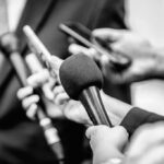 DOJ-Released Biden Tapes Reignite Questions Microphones and recorders held toward a speaker
