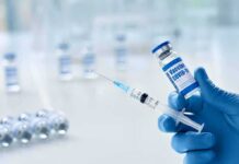 The ‘Spike Protein Detox’ Controversy Just Got Bigger Gloved hands holding a syringe and a vaccine vial