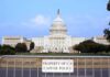 Tax Breaks for Some, Benefit Cuts for Millions View of the U.S. Capitol building with a security barrier in front