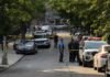 13-Year-Old Rescued After Interstate Kidnapping Police officers secure a residential street with patrol cars and yellow tape
