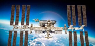 International Space Station with large solar arrays over Earth