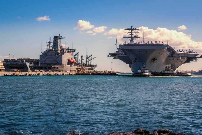 Aircraft carrier and support ships docked at a naval harbor
