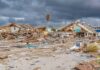 storm-damaged coastal neighborhood with demolished houses