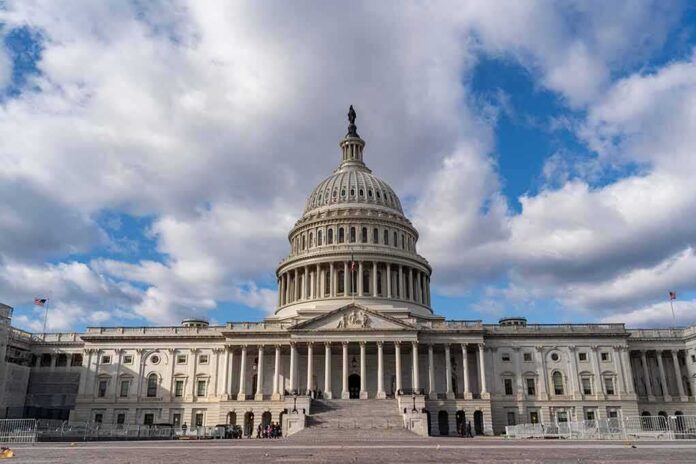 United States Capitol building under a partly cloudy sky