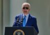 Hunter Biden Gives Grim Update on Joe Biden’s Cancer man in blue suit speaking at a podium with presidential seal