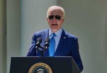 Hunter Biden Gives Grim Update on Joe Biden’s Cancer man in blue suit speaking at a podium with presidential seal