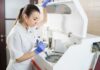 Lab technician using an analyzer with a pipette