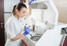 Dogs + AI Sniff Cancer — Doctors Stunned Lab technician using an analyzer with a pipette