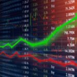 Stock market chart with green upward arrow and red downward line