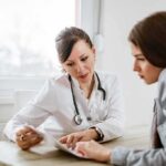 Fox Host Confronts Senate Candidate Doctor consulting a patient at a desk