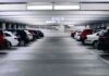 Row of parked cars in an indoor parking garage