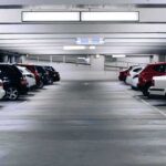 Clean-Car Rules Raise Cost Concerns Row of parked cars in an indoor parking garage