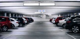 Row of parked cars in an indoor parking garage