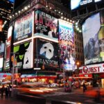 Bank of America Vice President Killed in Random Stabbing Vibrant night scene of Times Square filled with theater advertisements and neon lights