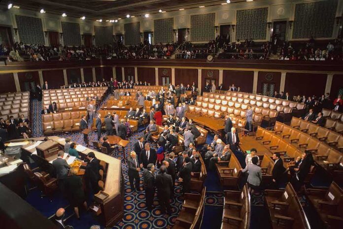 shutterstock_1082050127-1 Legislative chamber with members gathering on the floor