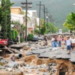Children Among Dead in Lebanon Night Strike Residents walk along a heavily damaged street after a disaster