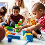 Thousands of Measles Cases Raise Alarm Across the United States Karyn Polito with toddlers building blocks on a play mat