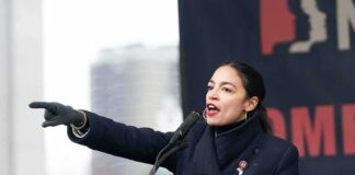 Woman speaking at a podium and pointing