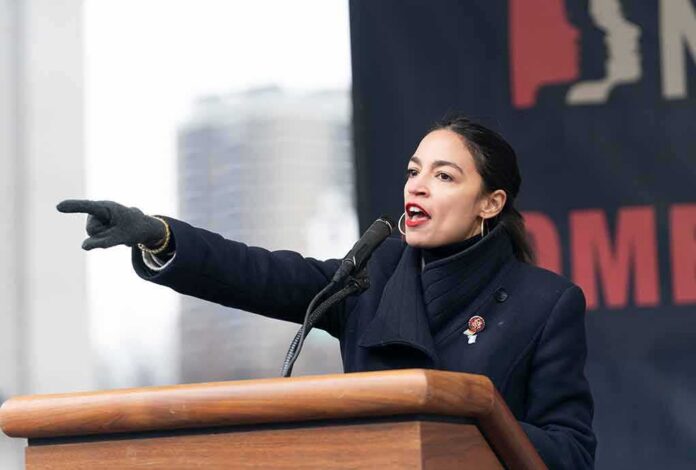 shutterstock_1289128267-1 Woman speaking at a podium and pointing