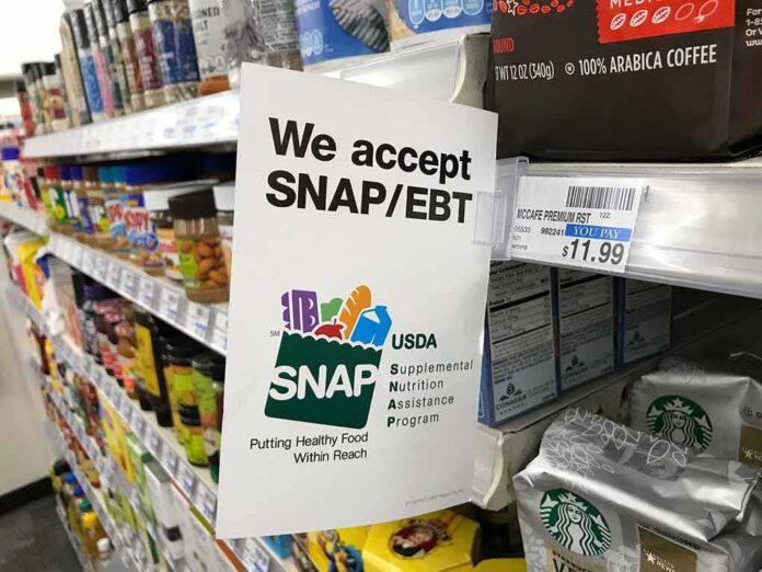 shutterstock_1476926681 Shelf sign in a grocery aisle showing SNAP EBT acceptance